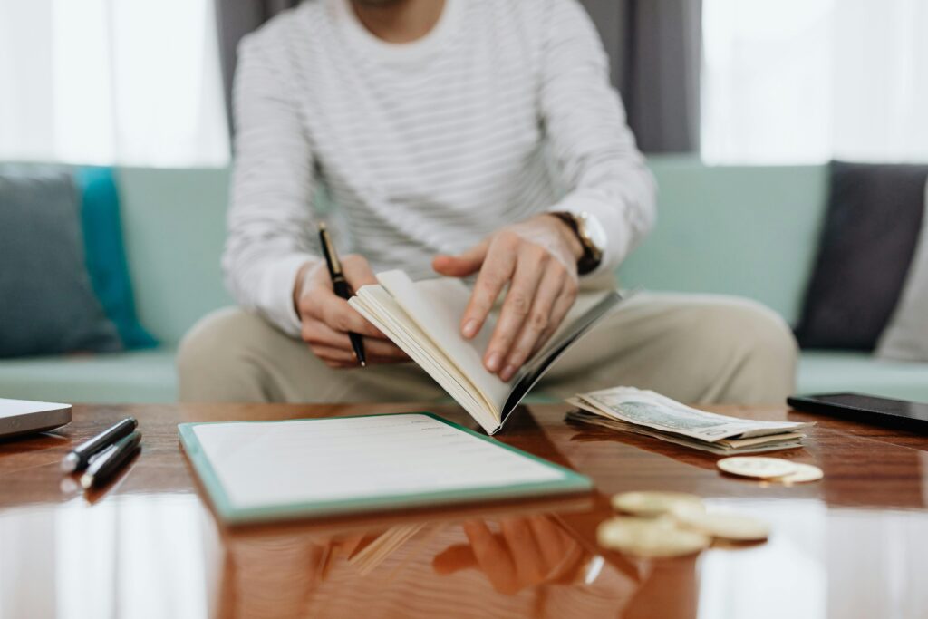 Small business owner opening a notebook