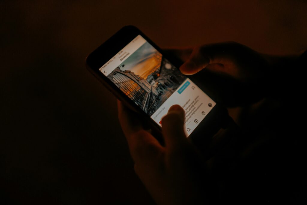 A person scrolling through a social media feed on a smartphone