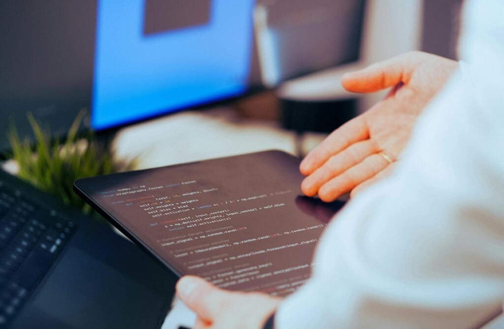 Tablet screen showing an implementation of AI code