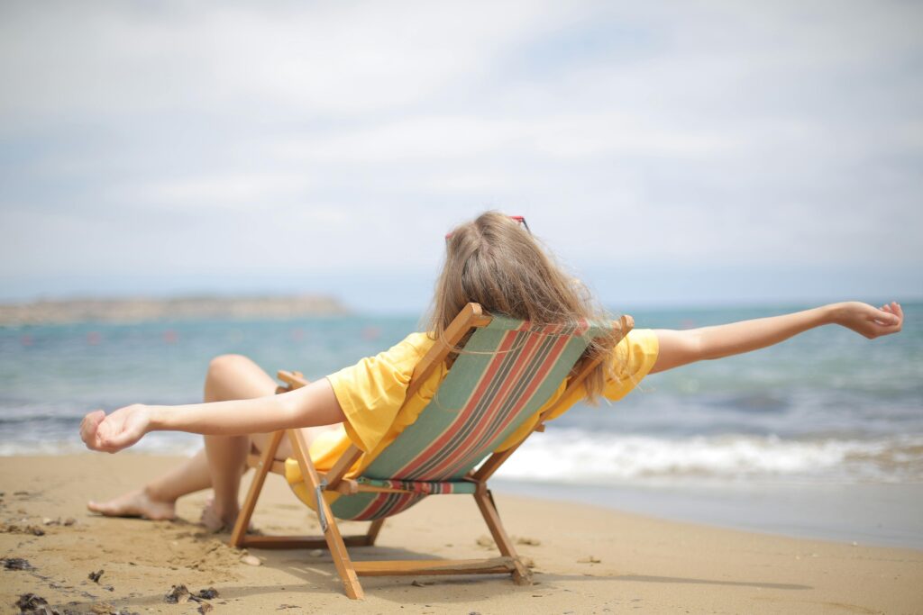 Woman lying on a hammock chair, enjoying her unlimited vacation