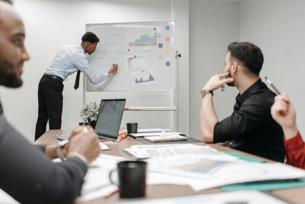 People in a conference room, likely a discussion on business strategy